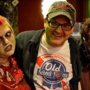 Filmmaker Joe Ostrica (center) at one of his annual OLD SCHOOL SINEMA zombie walk food drive events.