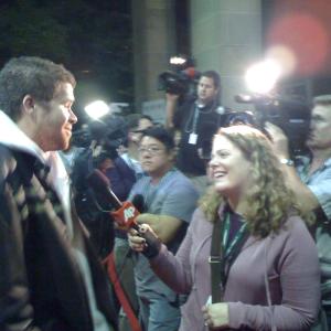 Josh Emerson being interviewed on the red carpet at TIFF for 