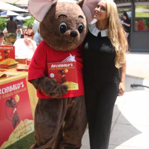 Actress Robin Arcuri posing with ARCHIBALDS mouse Hollywood Book Festival The Grove Hollywood California