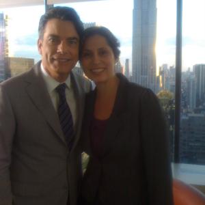 Carmen Lamar with Peter Gallagher on the set of 