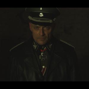 Sean Cronin as SS-MAJOR GENERAL JOSEF HEIDENBERG in ESCAPE TO GOSSAU
