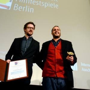 Director Mahdi Fleifel with producer Patrick Campbell receiving the Peace Film Prize for A WORLD NOT OURS at the 2013 Berlinale