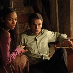 Still of Tim Daly and Zoe Saldana in The Skeptic 2009
