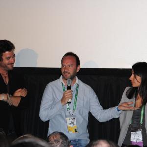 Directors Bryn Mooser (left), and Julia Bacha (right) listen as director Pascui Rivas (center) talks about 