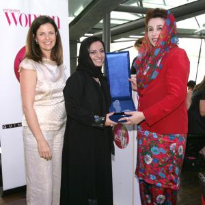 Nayla recieving the woman of the year award from the late Benazir Butto x Prime Minister of Pakistan