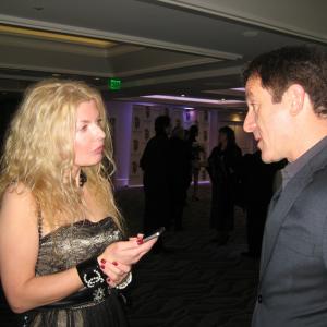 Adrienne Papp of Atlantic Publicity Interviewing Jason Isaacs at the 2012 International Press Academy Satellite Awards December 2012 Los Angeles