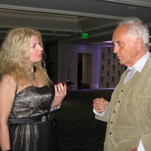 Adrienne Papp of Atlantic Publicity interviewing Terence Stamp, award winner at the 2012 International Press Academy Awards, December 16, 2012, Los Angeles
