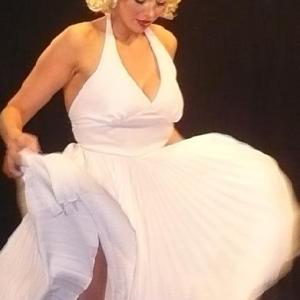 Janet playing the role of MArilyn in a commercial