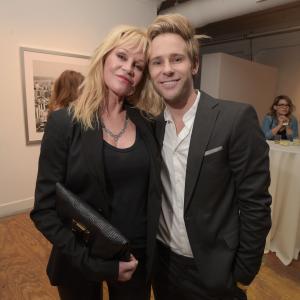 LOS ANGELES, CA - MAY 09: Actress Melanie Griffith (L) and artist Bryan Fox attend We. Alone. a photography exhibit by Bryan Fox at Think Tank Gallery on May 9, 2015 in Los Angeles, California.