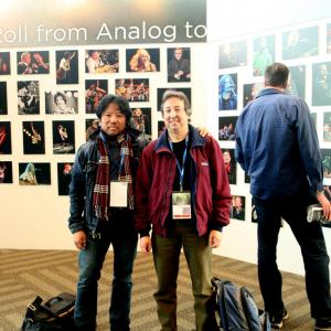 Craig Abaya and Philip J Gallegos in front of Craigs film and photo exhibit featured artist at MacWorld San Francisco
