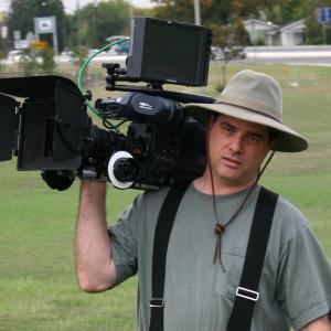 Michael Morlan carrying camera on the set of Double Tap