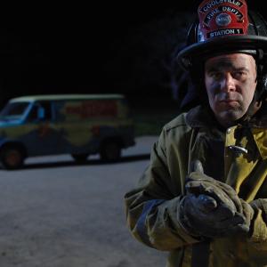 Jonathon Downs as a fireman on set for Scooby Doo Curse of the Lake Monster
