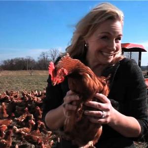Go Local Host Amy Hess with chicken at Dutch Creek Farm