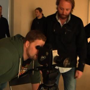 Matthew Bolton checking the shot on the set of Paranormal Incident
