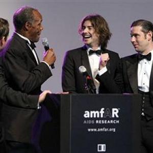 amfAR Cinema Against AIDS Dubai Gala From left Danny Glover and Victor Kubicek