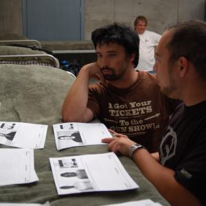 Chris Elston and Robert Perez pour over storyboards on the set of SHELTER