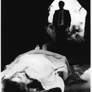 Zeno Angel Connell gazes at the toetagged corpse of his lover Marsha Morgan Zenobia as it lies inside the mysterious fogshrouded room of the Morgan family mortuary in a scene from filmmaker Angel Connells Shes So Cold 1995