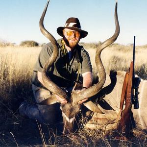 Buck McNeely on safari in Africa with a Kudu.