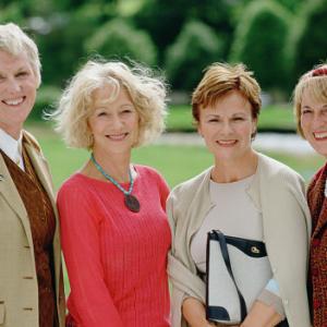 Legendary actresses Helen Mirren center left and Julie Walters center right pose with the inspirations for their characters two of the original calendar girls Tricia Stewart left and Angela Baker right
