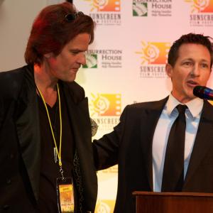 Tony Armer presents filmmaker Tom Garrett with a film grant at the 2010 Sunscreen Film Festival Awards Ceremony