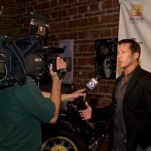 Executive Director of the Sunscreen Film Festival Tony Armer speaking with the media