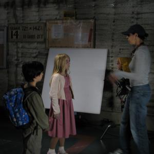 Madison and Conner getting instruction from Director Kim Moses on the set of Ghost Whisperer.