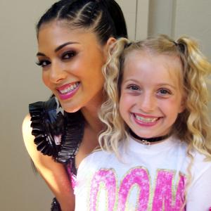 Posing with Nicole Scherzinger of the Pussycat Dolls before performing with them at the Kids Choice Awards 09