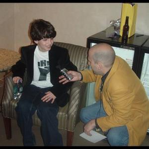 John Rebello being interviewed by Shuli, Howard 100 News, backstage at the Borgata, Atlantic City, New Jersey, Artie Lange show, 2007.