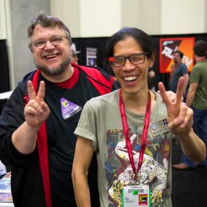 Guillermo del Toro and Justin Chung pose for a photo during exhibitor set-up at San Diego Comic-Con International 2014.