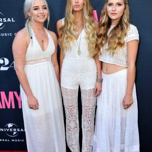 Musicians Sidney Sartini, Ruby Carr and Natalia Panzarella of the band Bahari attend the Premiere Of A24 Films 'Amy'.