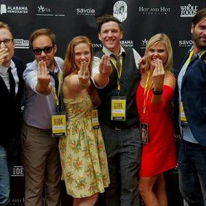 Filmmaking team and cast of Three Fingers on Sidewalk Film Festival's red carpet