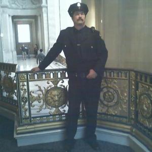 City Hall cop on set of milk guarding the stairs