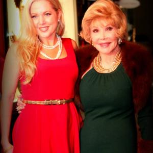 Actress Tammy Barr wearing a Jonathan Blake design from his FallWinter 2013 collection and Houston Socialite Joanne Herring wearing Cesar Galindo at the event of A Little Christmas Business Red Carpet arrivals Thursday December 5 2013