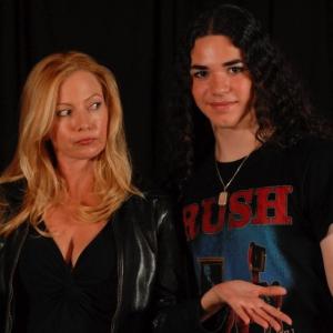 Ronnie Connell with Traci Lords at the reading table for Its all OK in Camelot