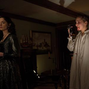 Still of Elise Eberle and Janet Montgomery in Salem 2014
