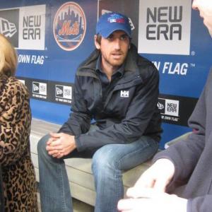 Taken prior to throwing out the first pitch at a New York Mets game vs. Washington Nationals -- sitting in the dugout