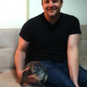 David Mizejewski backstage at the Wendy Williams Show with a juvenile penguin