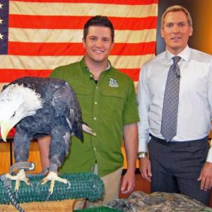 David Mizejewski, Sam Champion and a bald eagle on the set of Good Morning America in 2007.