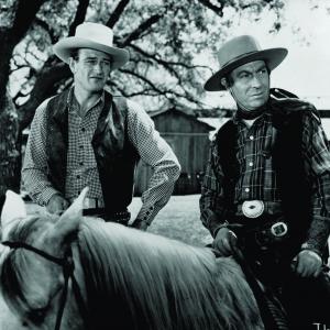 Still of John Wayne and Frank Puglia in Tall in the Saddle 1944