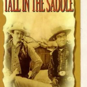 John Wayne and Frank Puglia in Tall in the Saddle (1944)