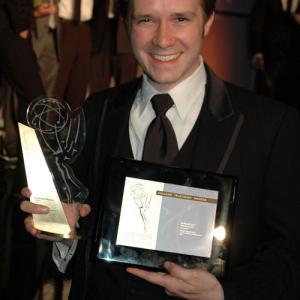 Inspector 42 director Nathan D Lee holding the awards for Best Drama and Best Director presented by the Academy of Television Arts and Sciences Foundation at the College Television Awards in Hollywood California April 10th 2010