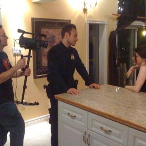 Director Dave McRae with Tonya Dodds and Greg Rombis on set shooting The Intruder
