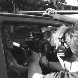 Azmyth Kaminski (L) and Doug Maguire (R) shoot a scene from Bank Roll (2013).
