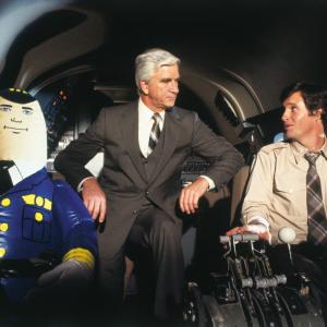 Still of Leslie Nielsen Robert Hays and Otto in Airplane! 1980