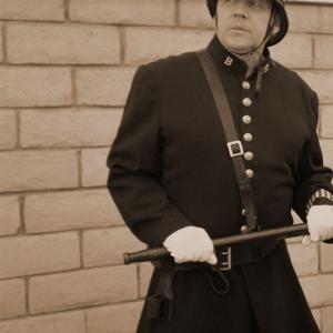 Mark Rooney as Officer Giles in Dr Jekyll