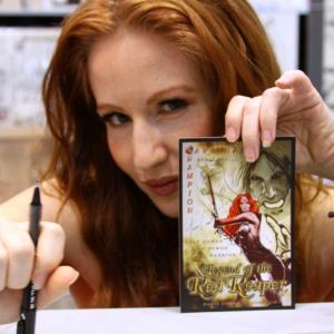 ActressComic Book creator Tara Cardinal signs the lobby card for fans at C2E2