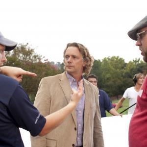 The brothers talk with actor John Schneider on the set of October Baby