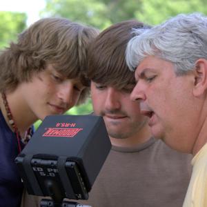 Andrew Wilson Williams, Josh Moody and Dave Moody review a scene during the filming of 