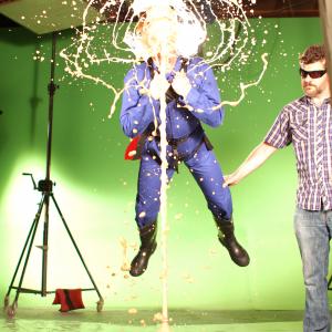 On the set of Discovery Channel Canada's Prank Science. Producer Brooks Gray with Eric Andrews as he gets blasted in the face... for science.