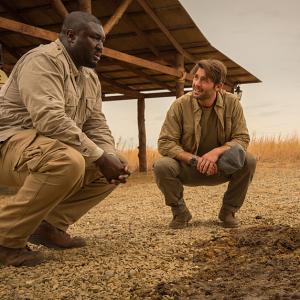 Still of Nonso Anozie and James Wolk in Zoo (2015)